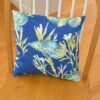 Sweet Pea Linens - Blue Seashell Outdoor Fabric 15 inch Accent Pillow (SKU#: R-1071-A13) - Table Setting