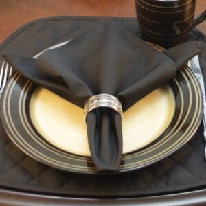 Sweet Pea Linens - Solid Black Rolled Hem Cloth Napkin (SKU#: R-1010-Y6) - Table Setting